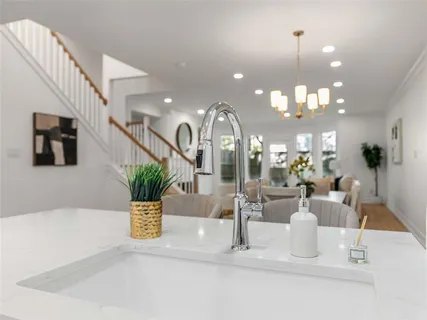 a view of a living room and chandelier