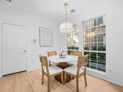 a dining room with furniture window wooden floor