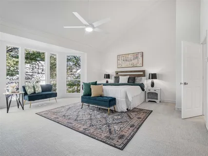 a bed room with a bed and a couch