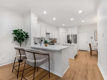 a kitchen with a table and chairs in it