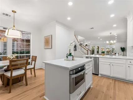 a kitchen with a stove and a table
