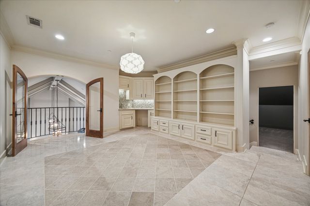 a view of a livingroom with a ceiling fan and window