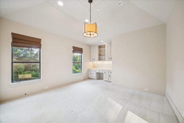 a spacious bathroom with a double vanity sink toilet mirror and shower