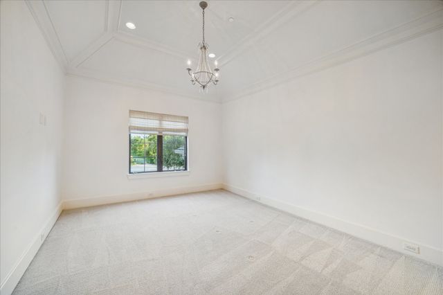 a bathroom with a granite countertop double vanity sink and a mirror