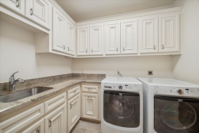 a view of an outdoor dining space with a table and chairs