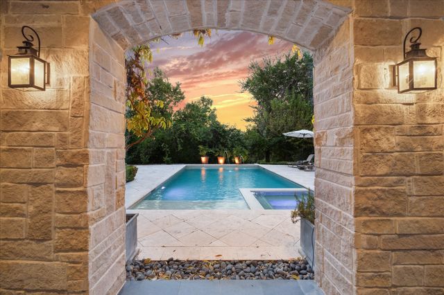 a view of a swimming pool with lounge chair