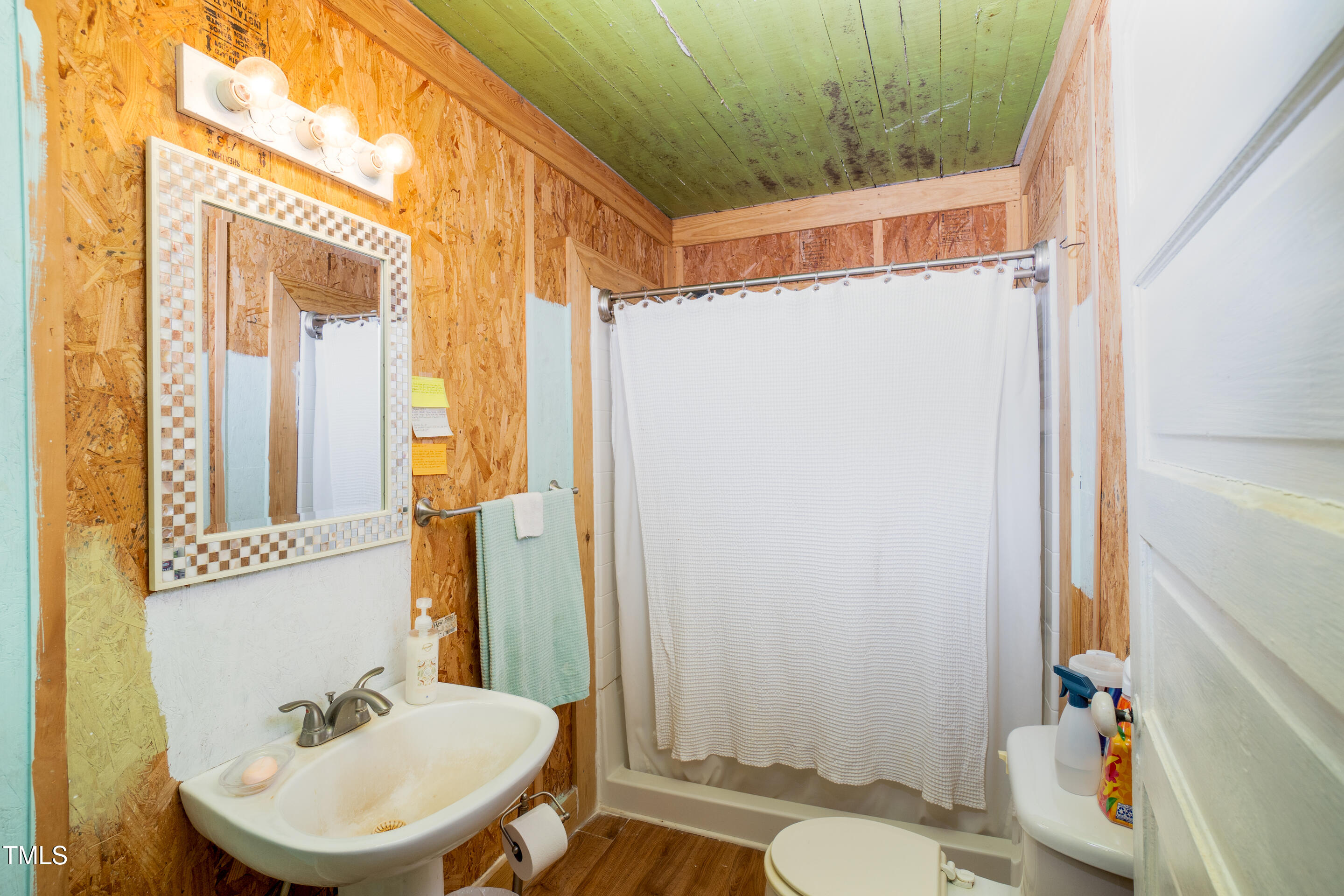 7167 Adolph Road Bailey, NC 27807 - Photo 12 of 18 a bathroom with a sink and a mirror