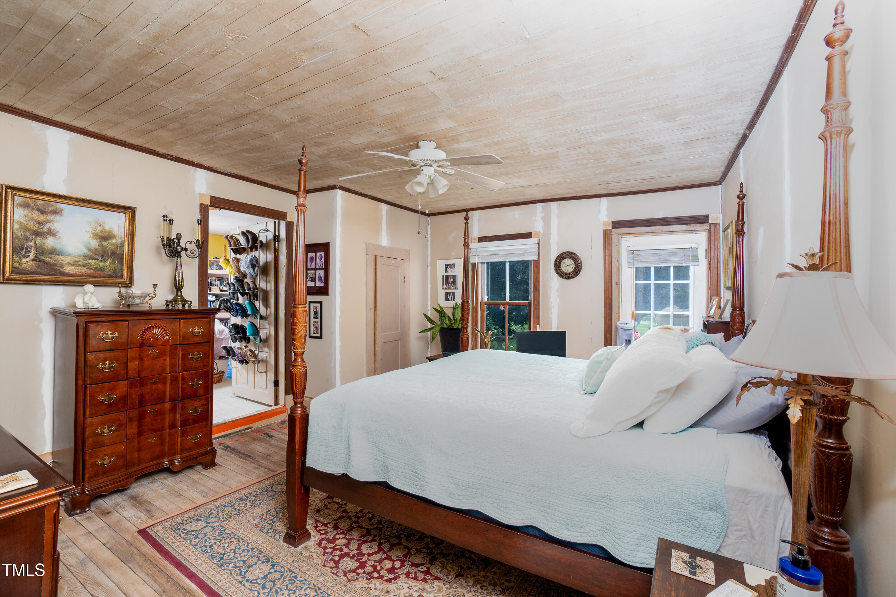 7167 Adolph Road Bailey, NC 27807 - Photo 13 of 18 a bedroom with a large bed and a dresser