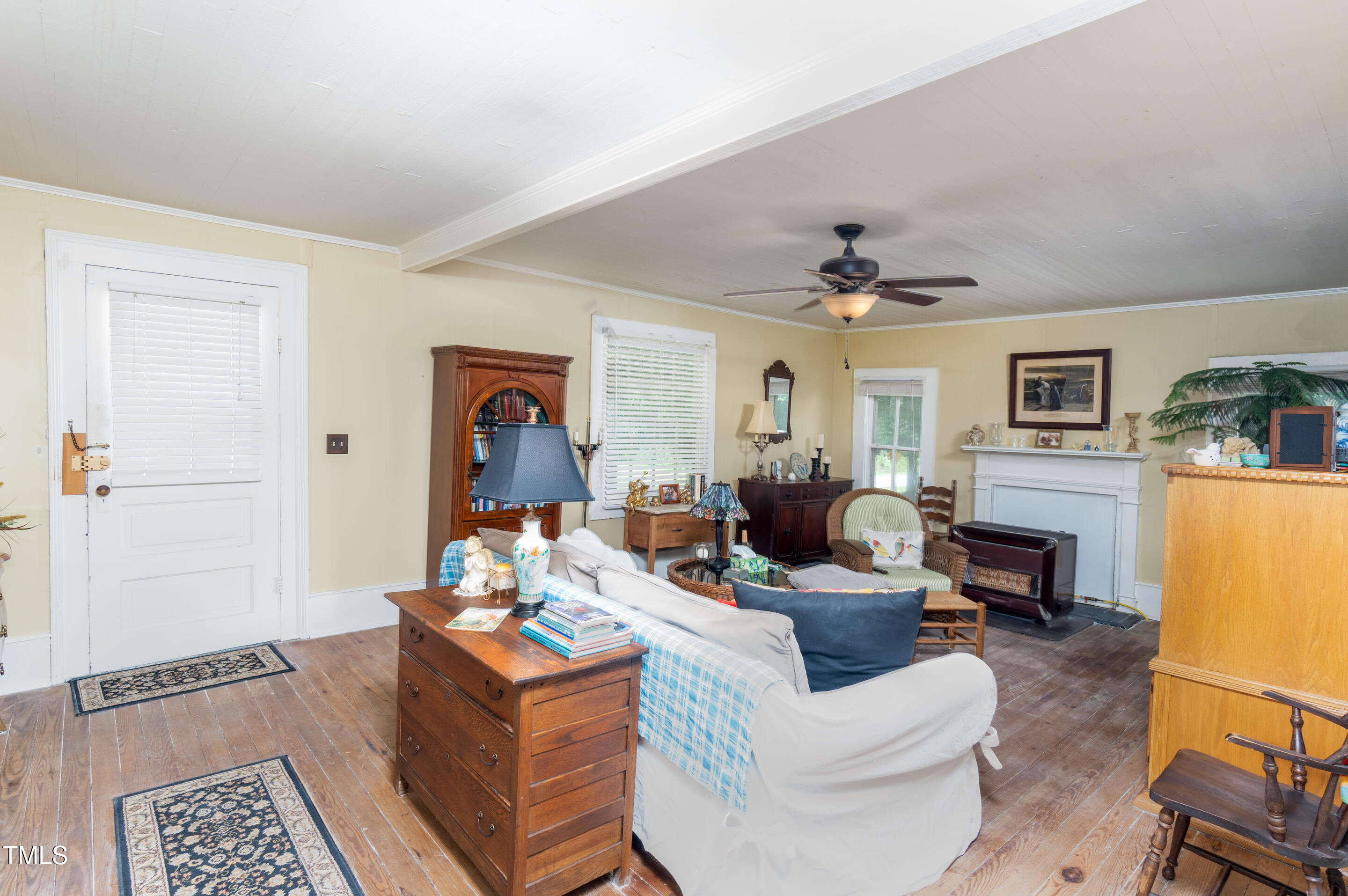 7167 Adolph Road Bailey, NC 27807 - Photo 7 of 18 a living room with furniture and a fireplace