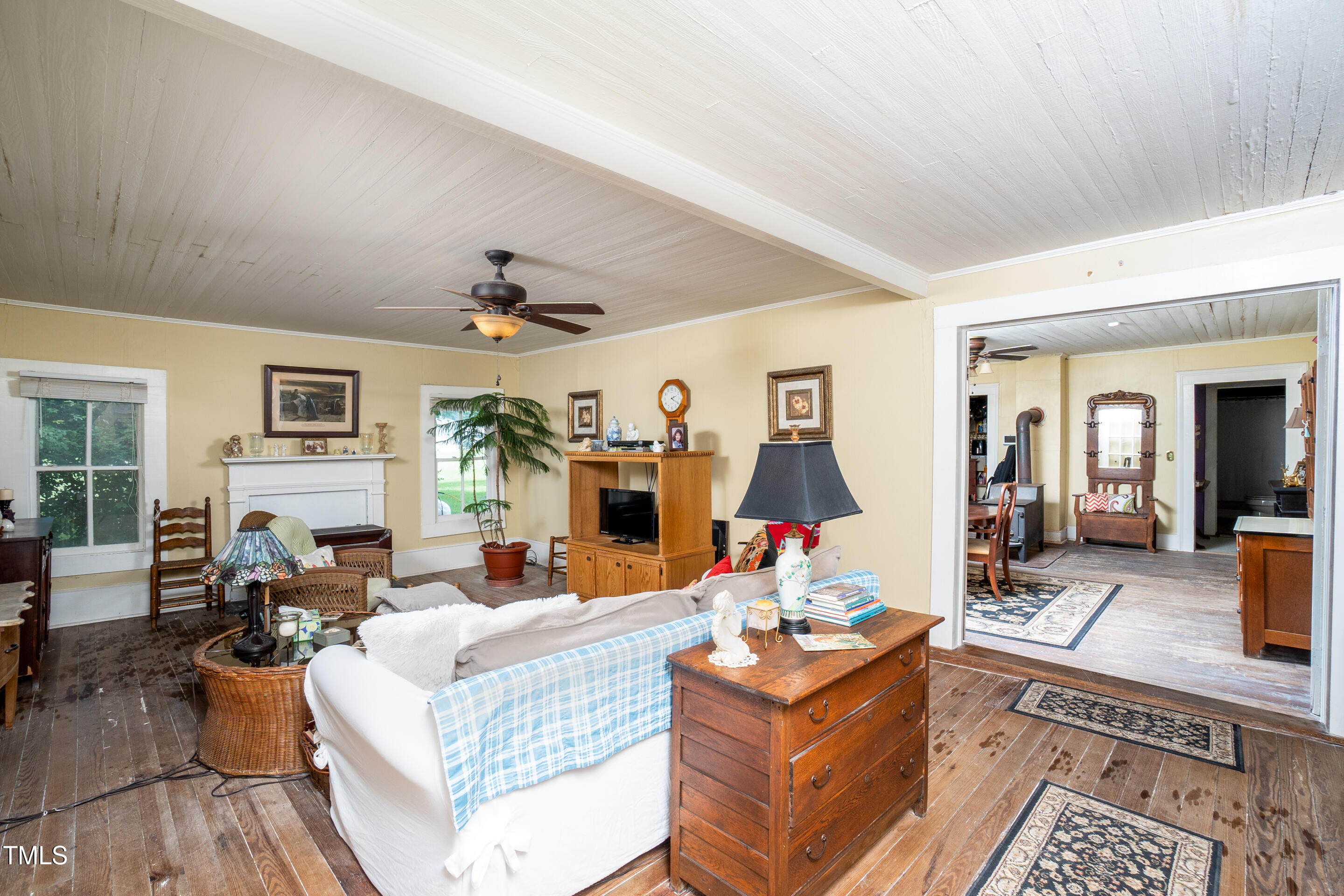 7167 Adolph Road Bailey, NC 27807 - Photo 8 of 18 a living room with furniture potted plant kitchen view and a large window
