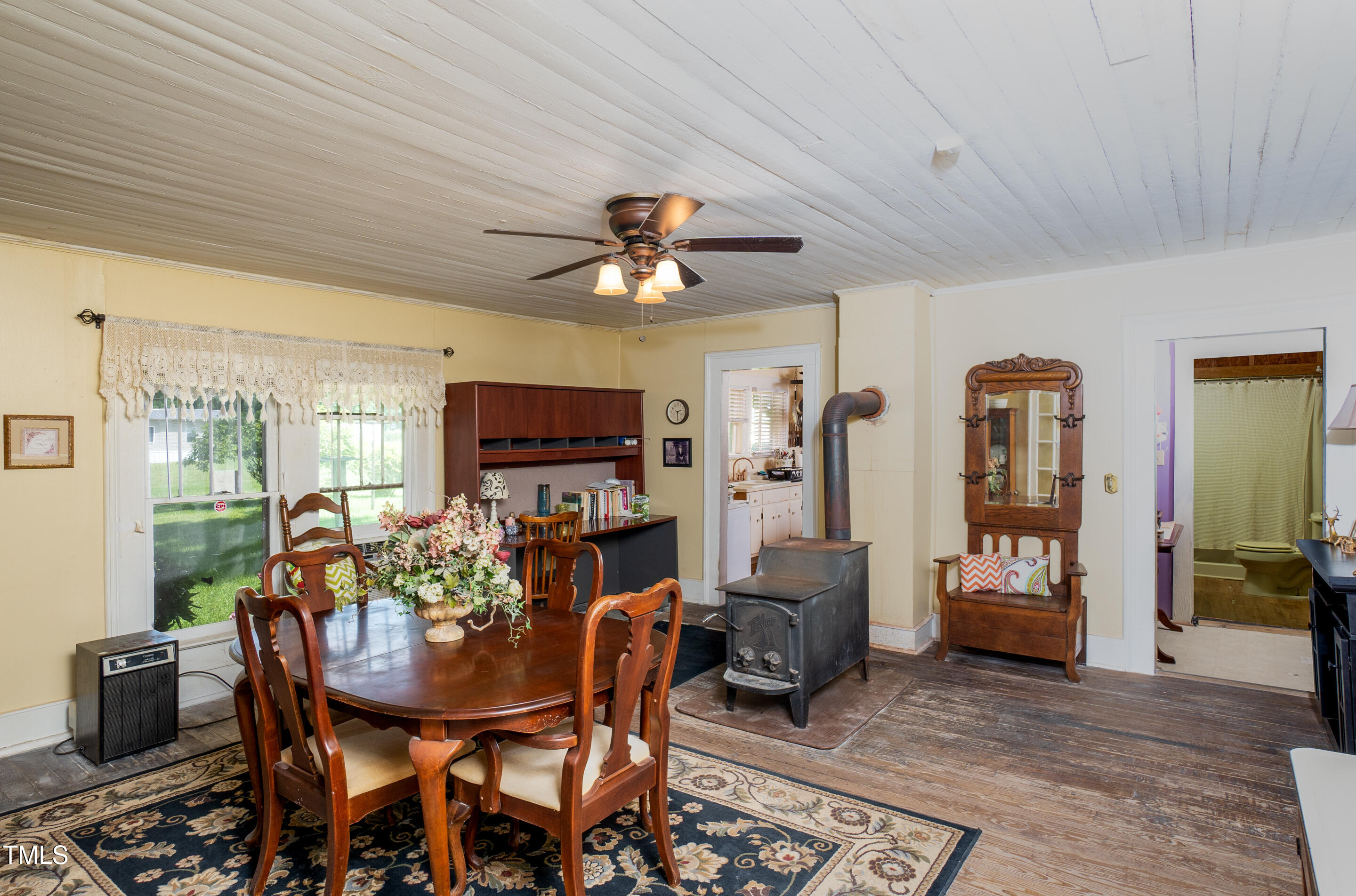 7167 Adolph Road Bailey, NC 27807 - Photo 10 of 18 a living room with furniture a flat screen tv and a table