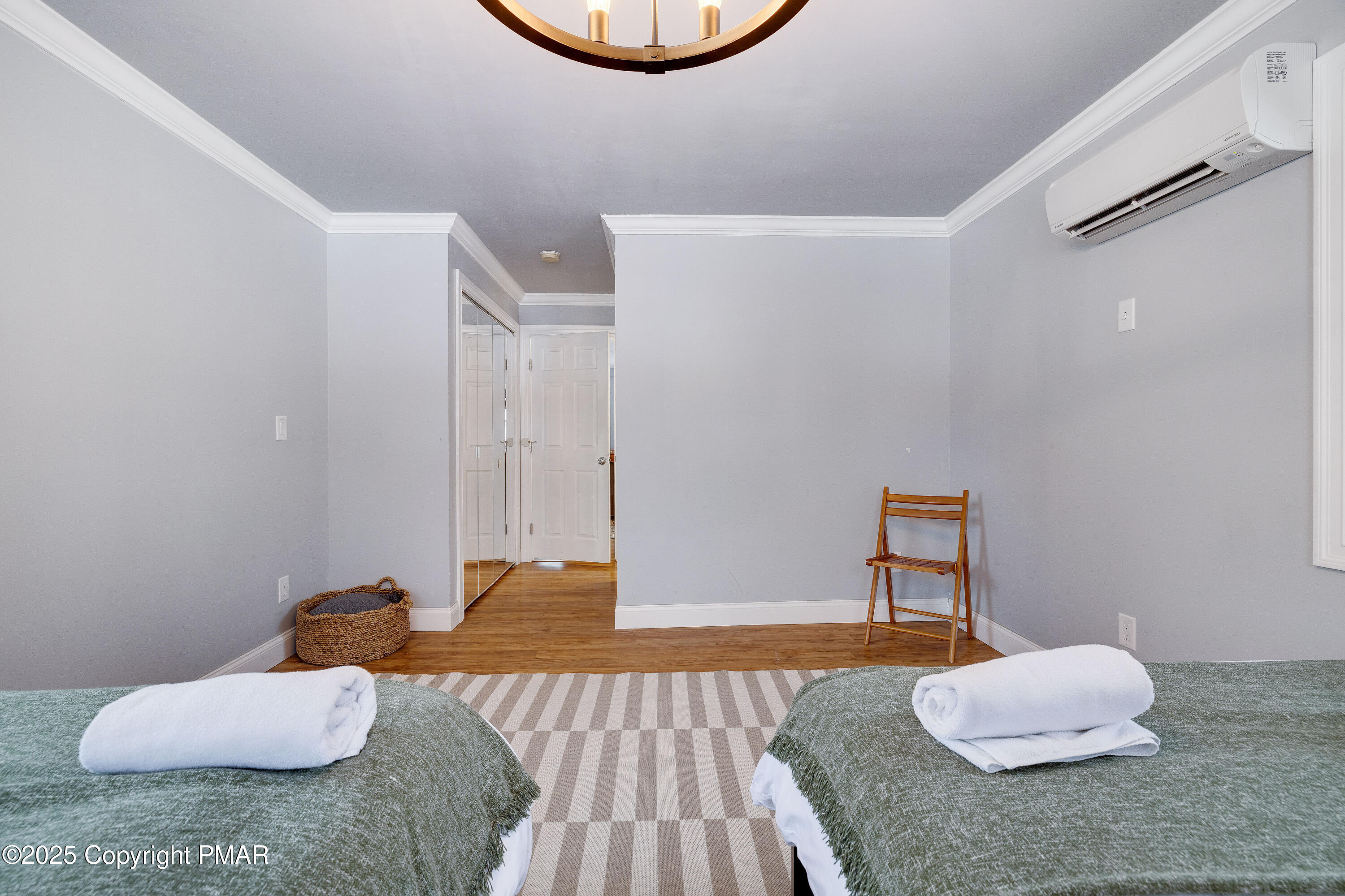 3137 Fern Road Pocono Summit, PA 18346 - Photo 19 of 51 a bedroom with a bed and a potted plant