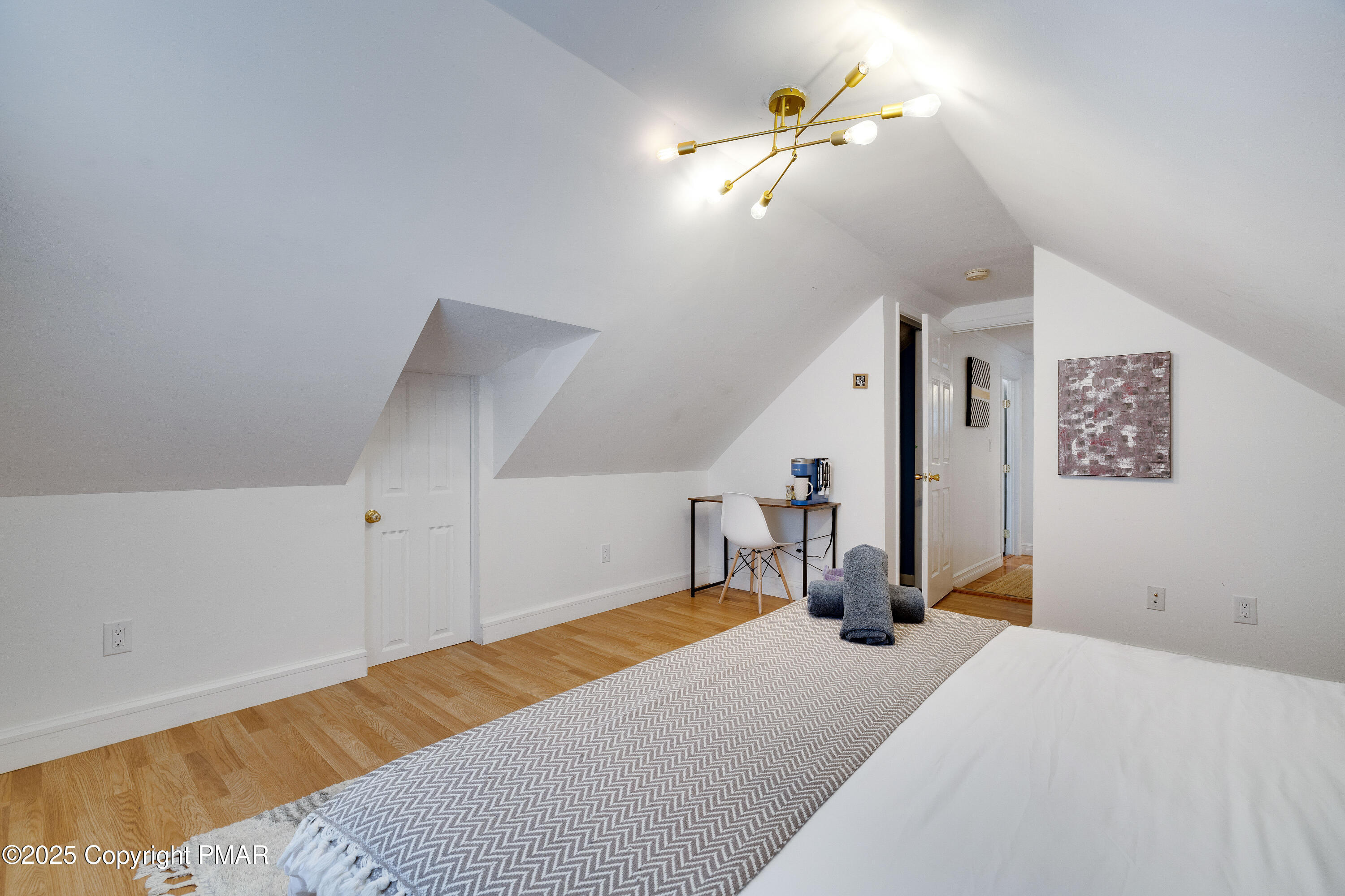 3137 Fern Road Pocono Summit, PA 18346 - Photo 22 of 51 a bed room with a bed and a chandelier