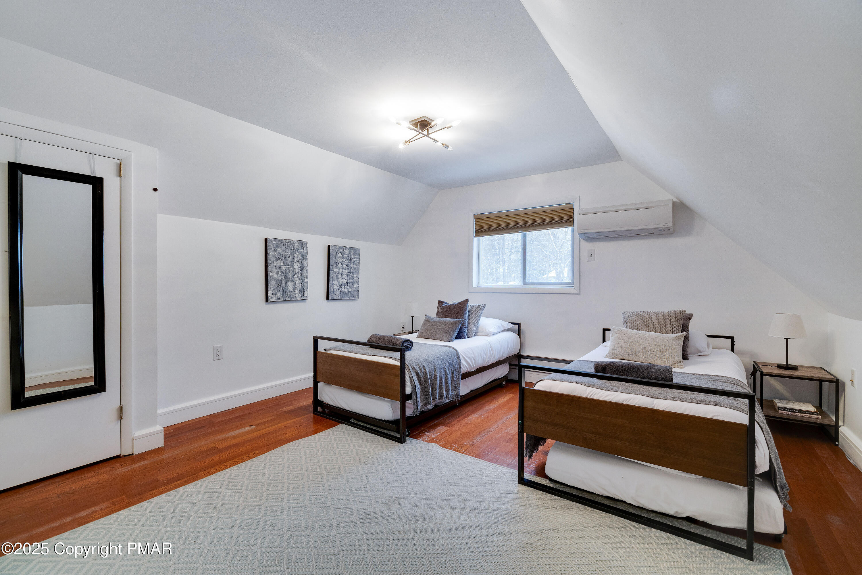3137 Fern Road Pocono Summit, PA 18346 - Photo 23 of 51 a bedroom with furniture and a lamp