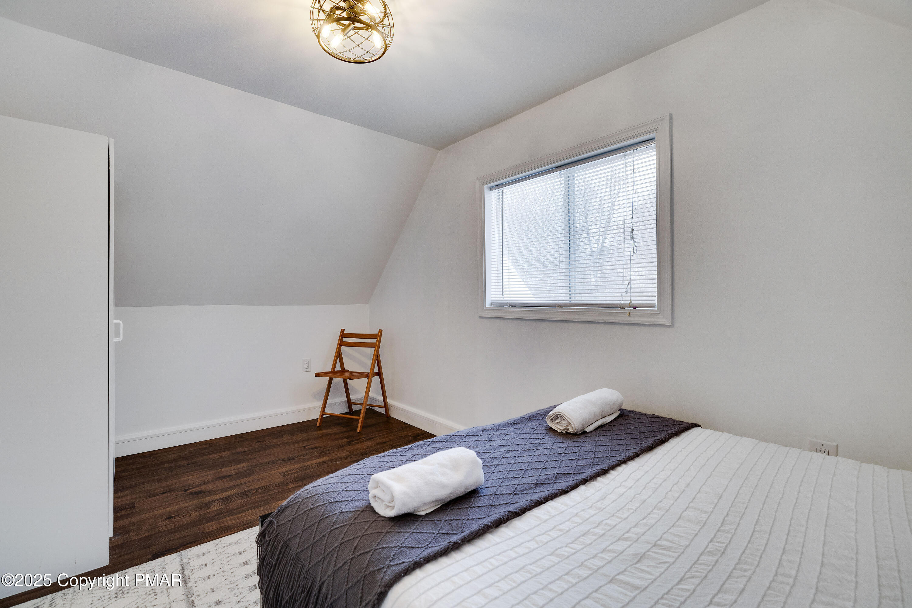 3137 Fern Road Pocono Summit, PA 18346 - Photo 26 of 51 a bedroom with a bed and a window