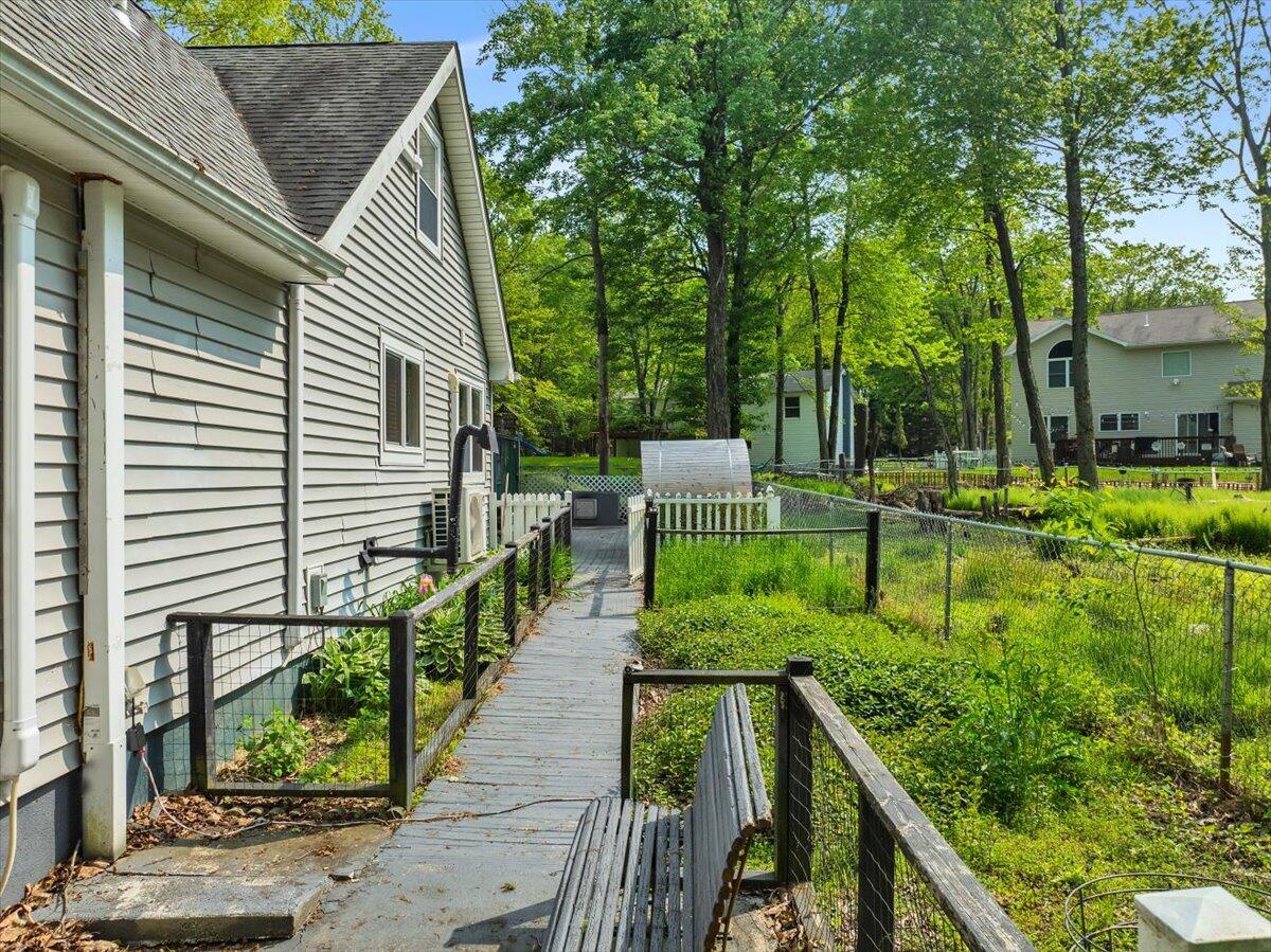 3137 Fern Road Pocono Summit, PA 18346 - Photo 34 of 51 a view of house with backyard and sitting area
