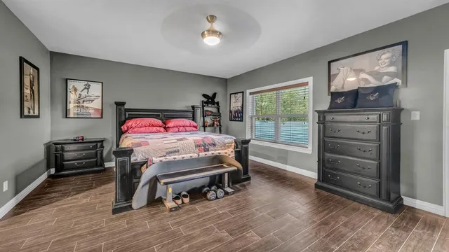 a bedroom with furniture and a window