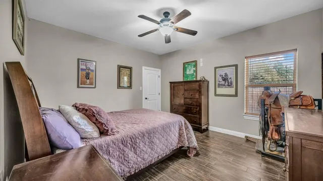 a bedroom with furniture and a chandelier