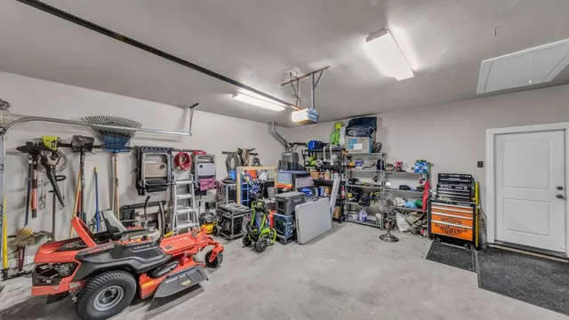 a view of a garage with a bike and car