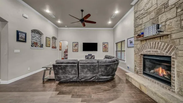 a living room with furniture and a fireplace