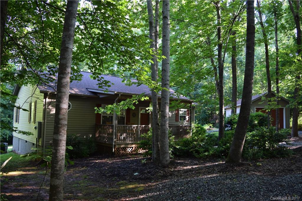 171 Observation Ridge Rutherfordton, NC 28139 - Photo 20 of 24 a view of a patio with table and chairs under an umbrella