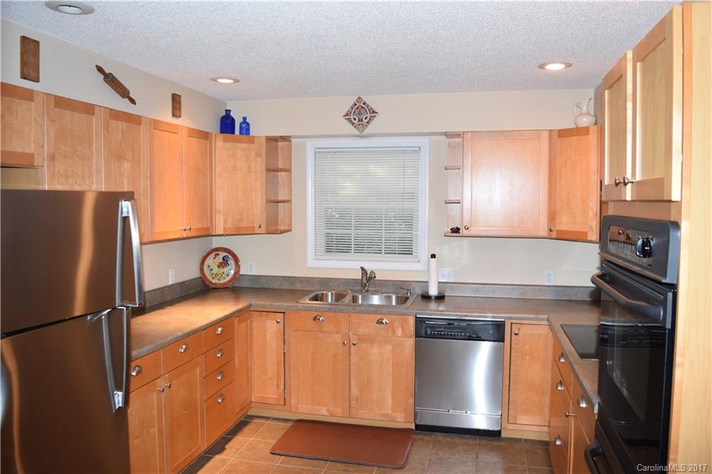 171 Observation Ridge Rutherfordton, NC 28139 - Photo 3 of 24 a kitchen with a sink a refrigerator and window