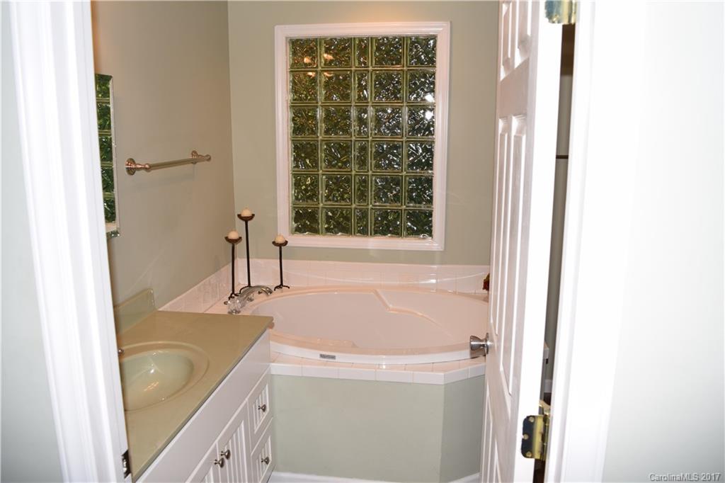 171 Observation Ridge Rutherfordton, NC 28139 - Photo 23 of 24 a bathroom with a tub sink and mirror