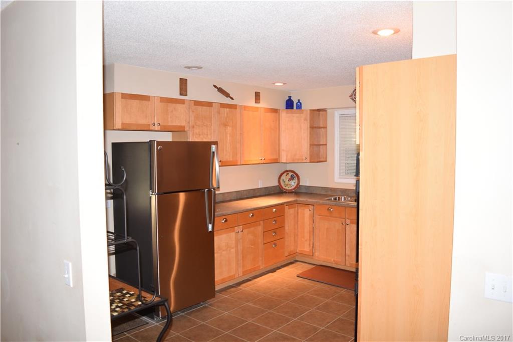 171 Observation Ridge Rutherfordton, NC 28139 - Photo 4 of 24 a view of a kitchen with a sink and refrigerator