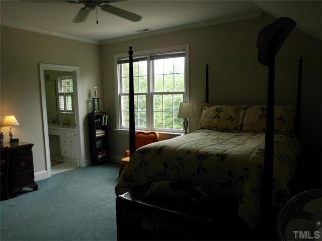 3100 Darien Drive Raleigh, NC 27607 - Photo 12 of 17 a bedroom with a bed and a window