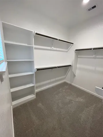a view of an empty walk in closet
