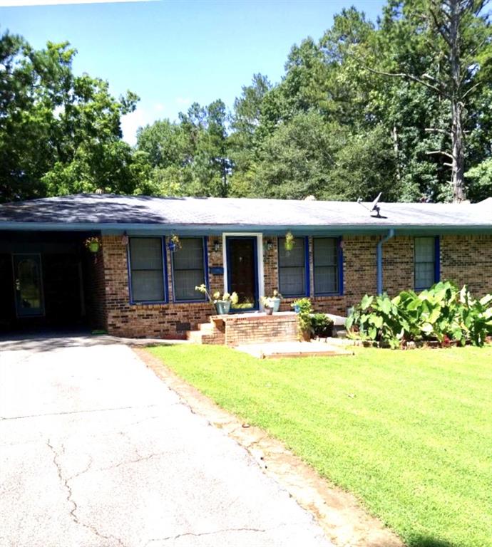 3929 Crossvale Road Lithonia, GA 30038 - Photo 1 of 1 a view of house with yard outdoor seating and yard