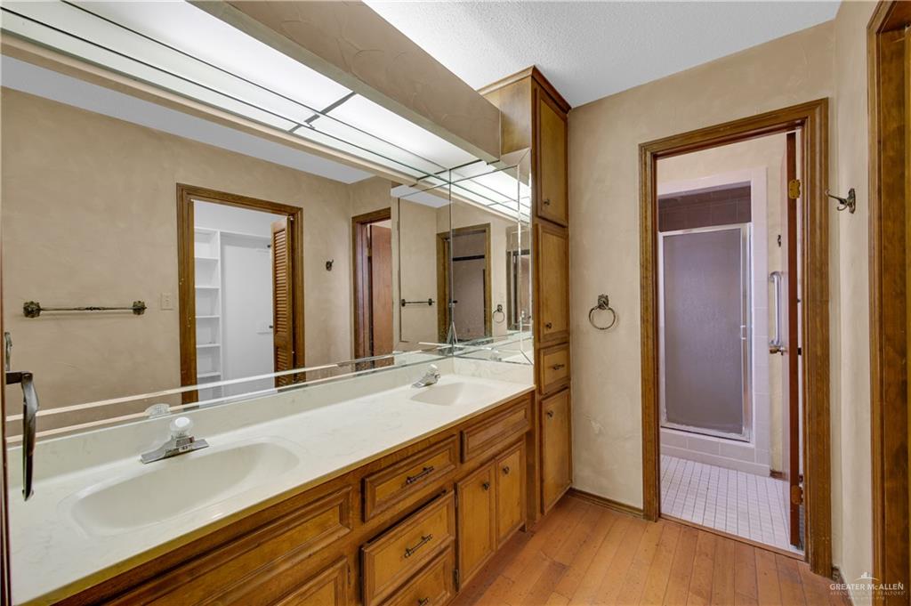 2016 South 5th Street, Unit 17 McAllen, TX 78503 - Photo 12 of 20 a bathroom with a double vanity sink and a mirror