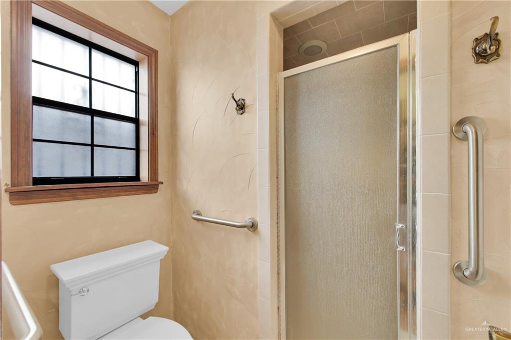 2016 South 5th Street, Unit 17 McAllen, TX 78503 - Photo 14 of 20 a bathroom with a toilet sink and shower