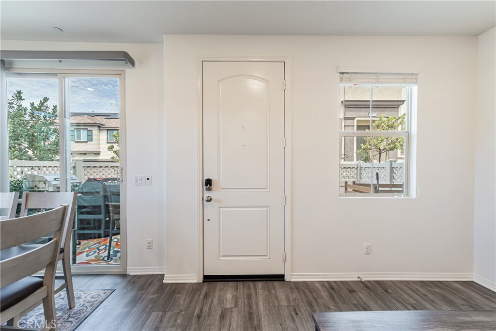 41973 Rondo Street, Unit 1203 Murrieta, CA 92562 - Photo 13 of 48 an empty room with wooden floor and windows