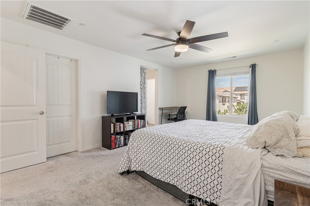 41973 Rondo Street, Unit 1203 Murrieta, CA 92562 - Photo 17 of 48 a bedroom with a bed and a television