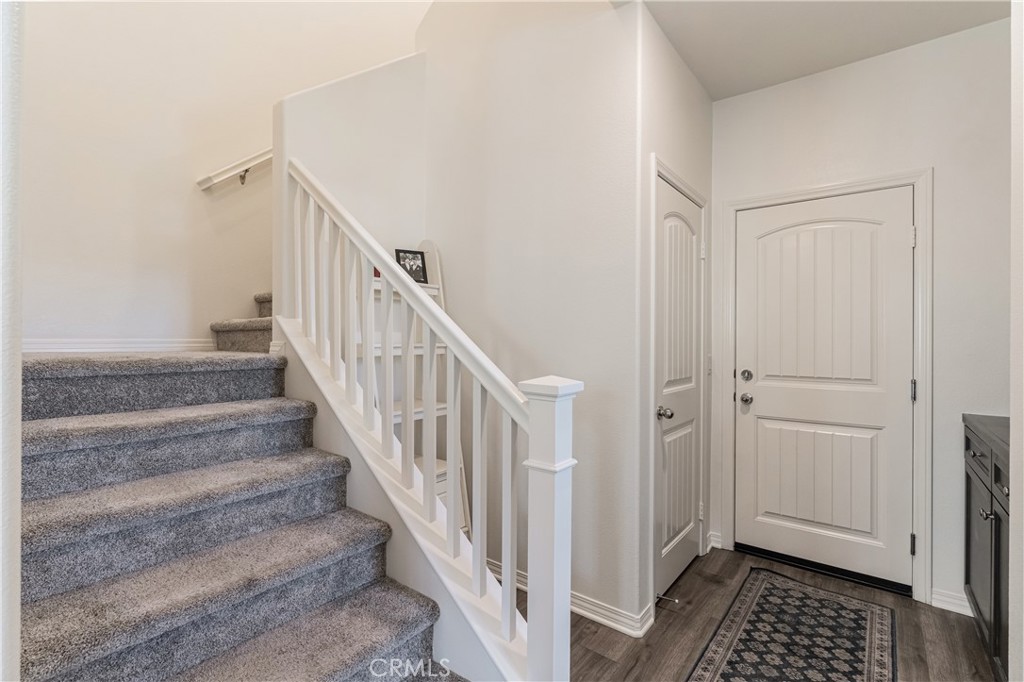41973 Rondo Street, Unit 1203 Murrieta, CA 92562 - Photo 31 of 48 a view of entryway with wooden floor and stairs