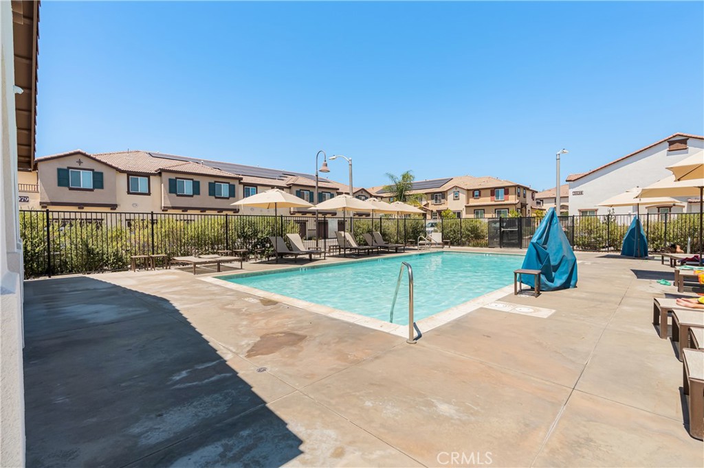 41973 Rondo Street, Unit 1203 Murrieta, CA 92562 - Photo 37 of 48 a view of a tennis ground with large trees
