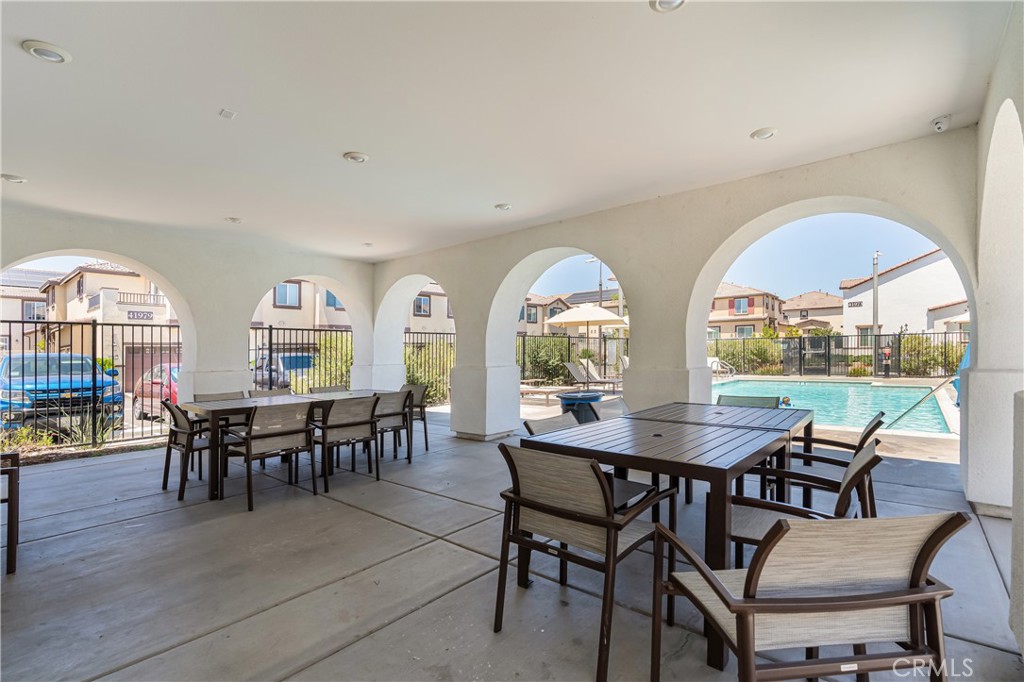 41973 Rondo Street, Unit 1203 Murrieta, CA 92562 - Photo 39 of 48 a view of a dining room with furniture window and outside view