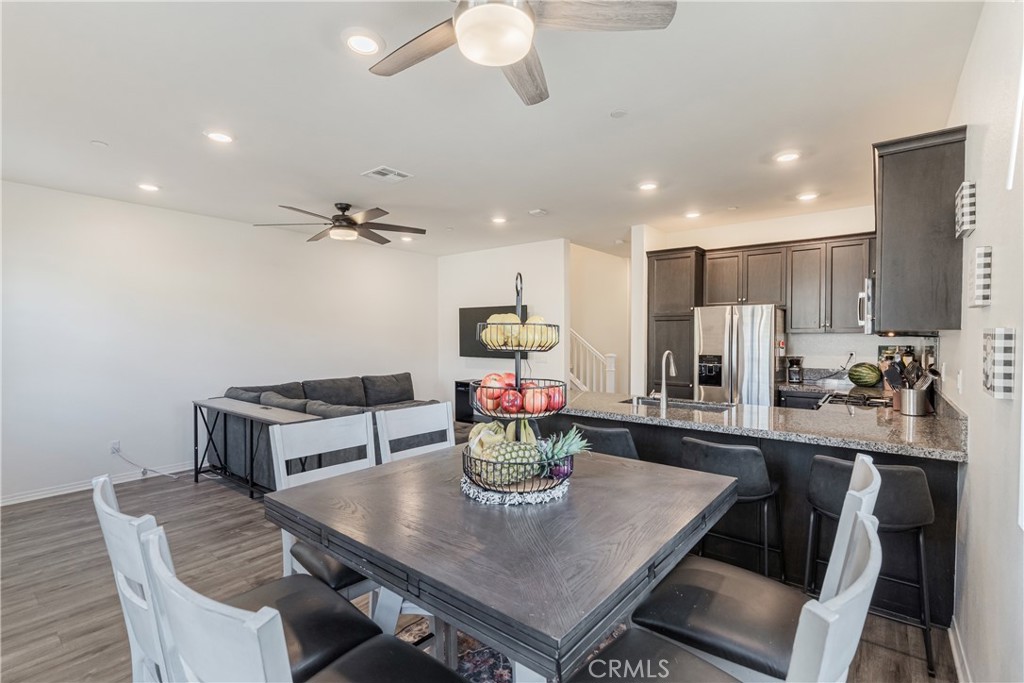 41973 Rondo Street, Unit 1203 Murrieta, CA 92562 - Photo 9 of 48 a view of a dining room with furniture