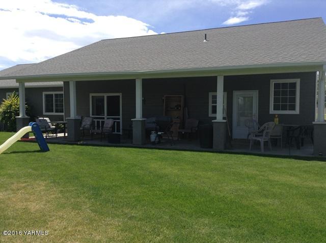 5407 Postma Road Yakima, WA 98901 - Photo 10 of 31 a view of a house with a yard and porch