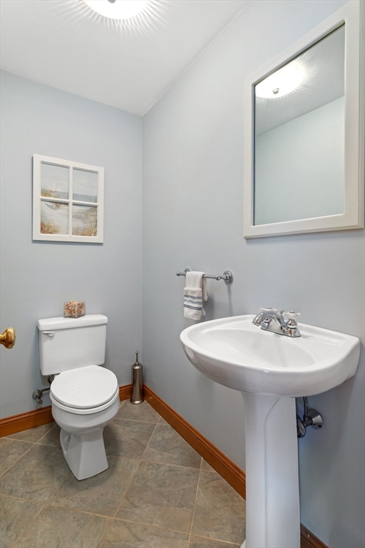 80 Squanto Road Quincy, MA 02169 - Photo 11 of 42 a bathroom with a toilet sink and mirror
