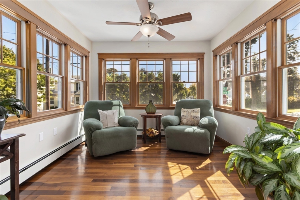 80 Squanto Road Quincy, MA 02169 - Photo 14 of 42 a living room with furniture and a large window with wooden floor