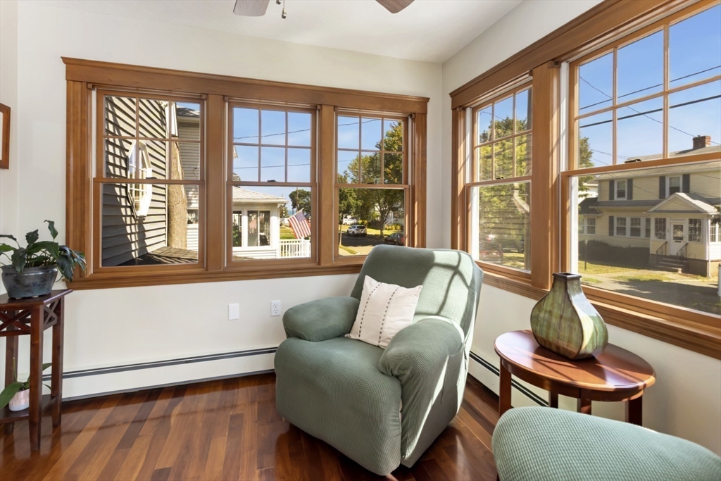 80 Squanto Road Quincy, MA 02169 - Photo 16 of 42 a living room with furniture and a floor to ceiling window
