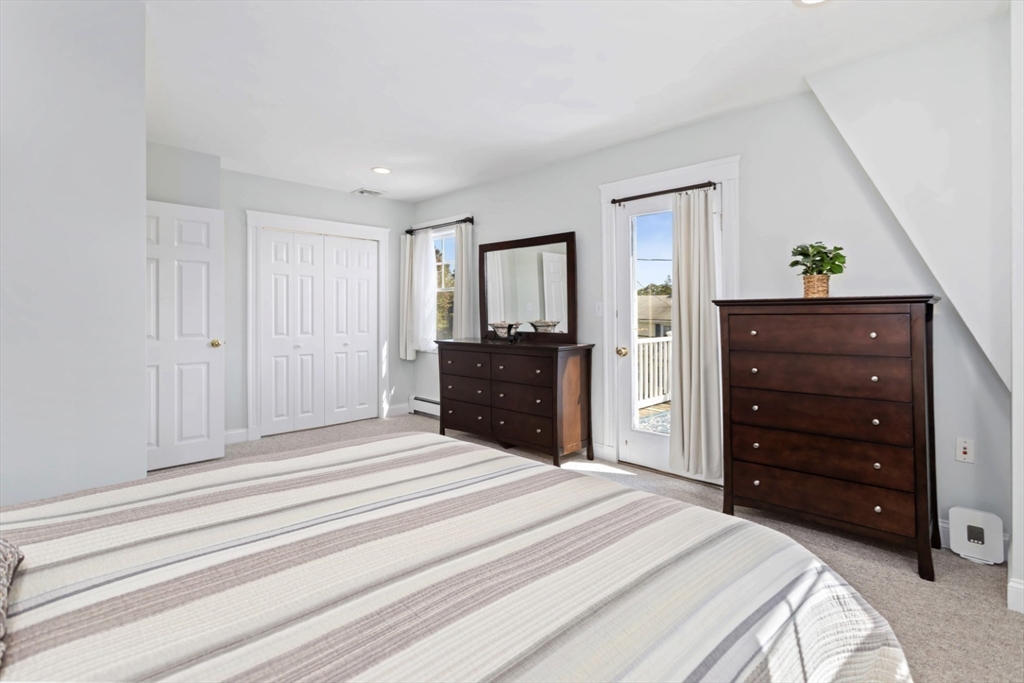 80 Squanto Road Quincy, MA 02169 - Photo 19 of 42 a bedroom with a bed and a dresser