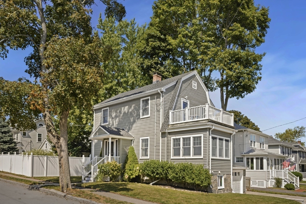 80 Squanto Road Quincy, MA 02169 - Photo 2 of 42 a front view of a house with a garden