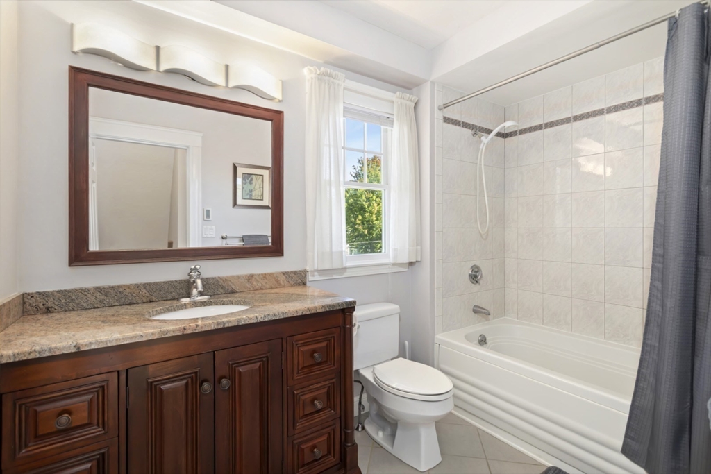 80 Squanto Road Quincy, MA 02169 - Photo 21 of 42 a bathroom with a granite countertop sink toilet and shower