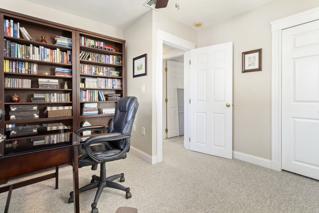 80 Squanto Road Quincy, MA 02169 - Photo 23 of 42 a view of a workspace with bookshelf
