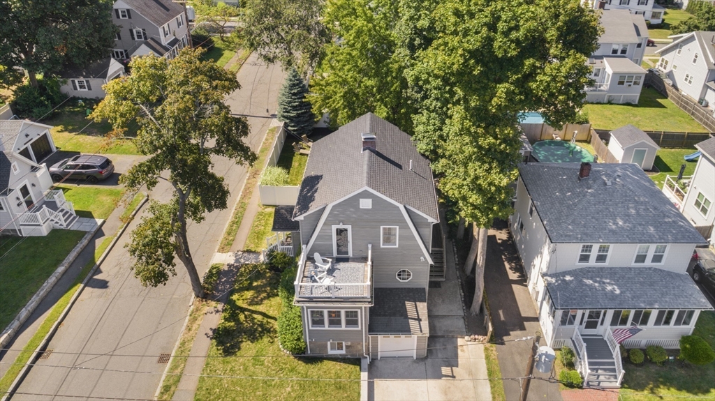 80 Squanto Road Quincy, MA 02169 - Photo 3 of 42 an aerial view of a residential apartment building with a yard