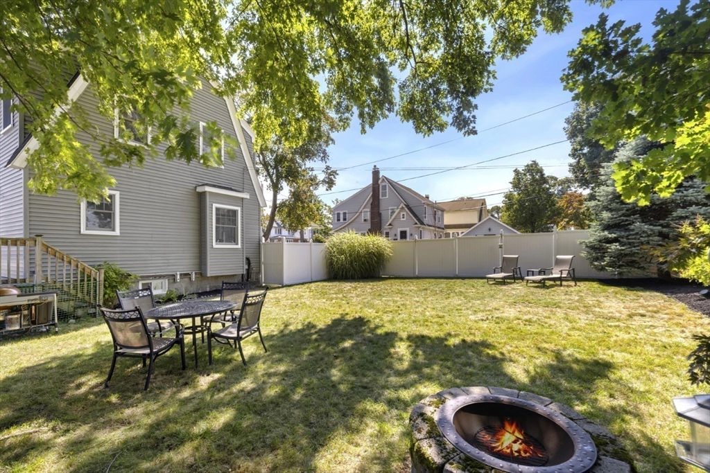 80 Squanto Road Quincy, MA 02169 - Photo 33 of 42 a backyard of a house with table and chairs
