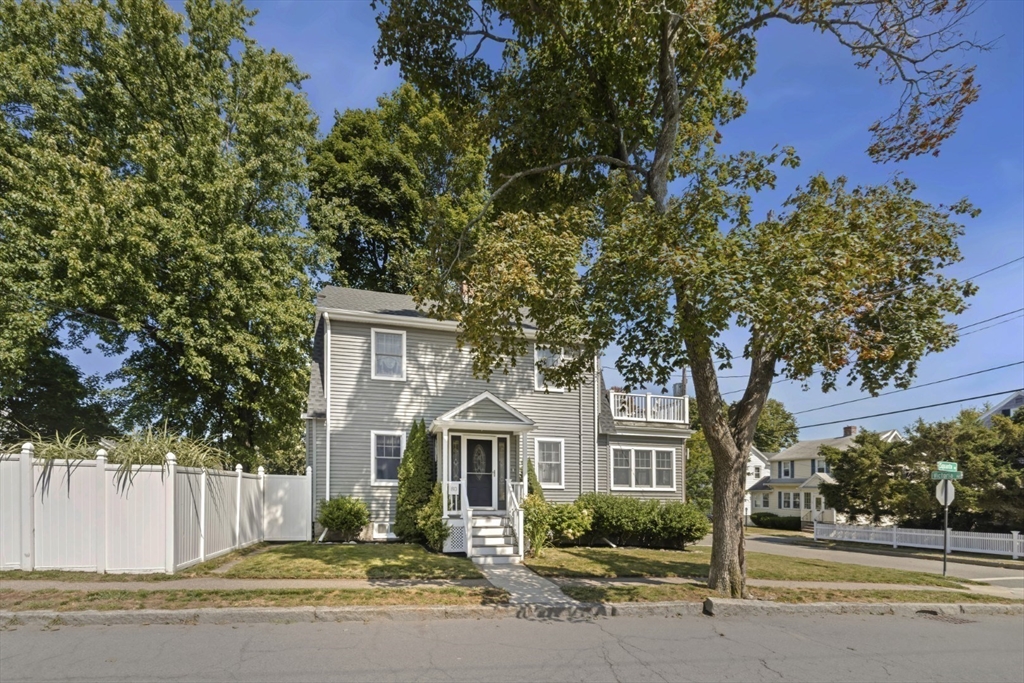 80 Squanto Road Quincy, MA 02169 - Photo 4 of 42 a front view of a house with a garden
